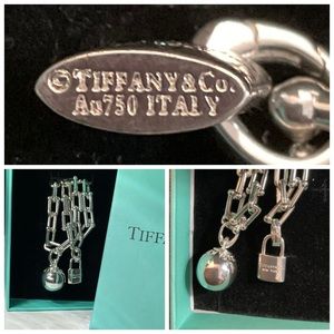 Tiffany ag 92.5(silver) Italy chain links and ball (w) 18k white gold lock.